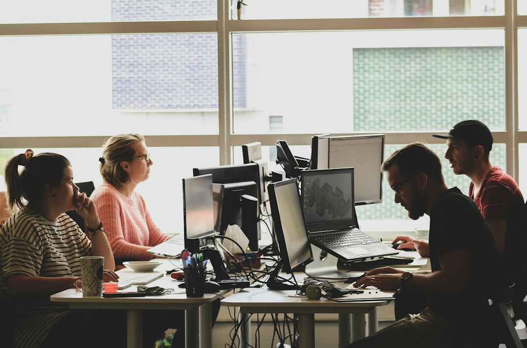 group of people coding together